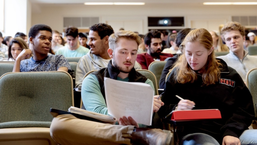 Students sit in a classroom