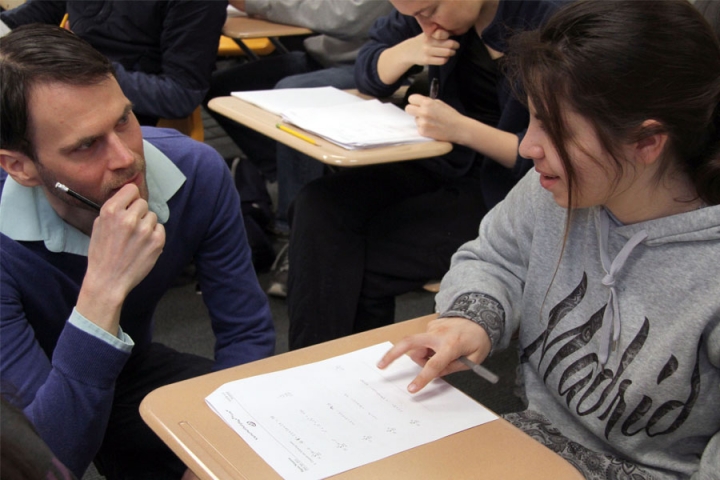 Faculty interacting with students during class