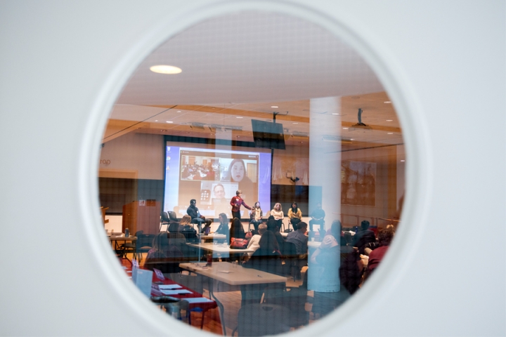The Cornell Online Learning Community Annual Event through the round window of the room door