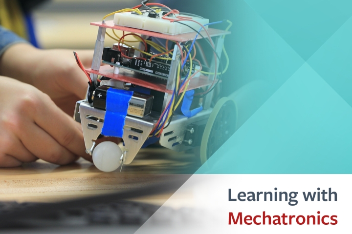  Image of hands working on a robot with Learning with mechatronics graphic
