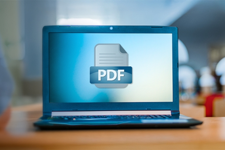 Open laptop with PDF icon