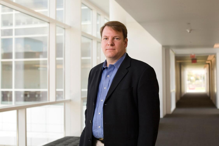 Chris Schaffer, blonde man in navy suit coat